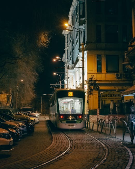 Modern tram moving through a historic Bucharest boulevard