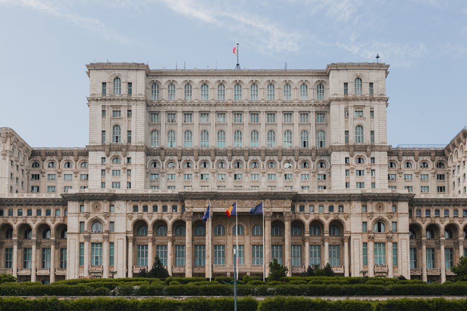 grand facade of the Palace of Parliament in daytime