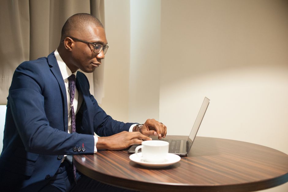 Business traveler hotel room workspace