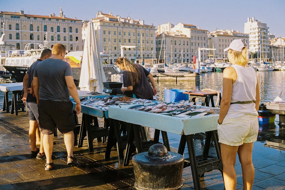 Vieux-Port at sunrise with boats and food stalls