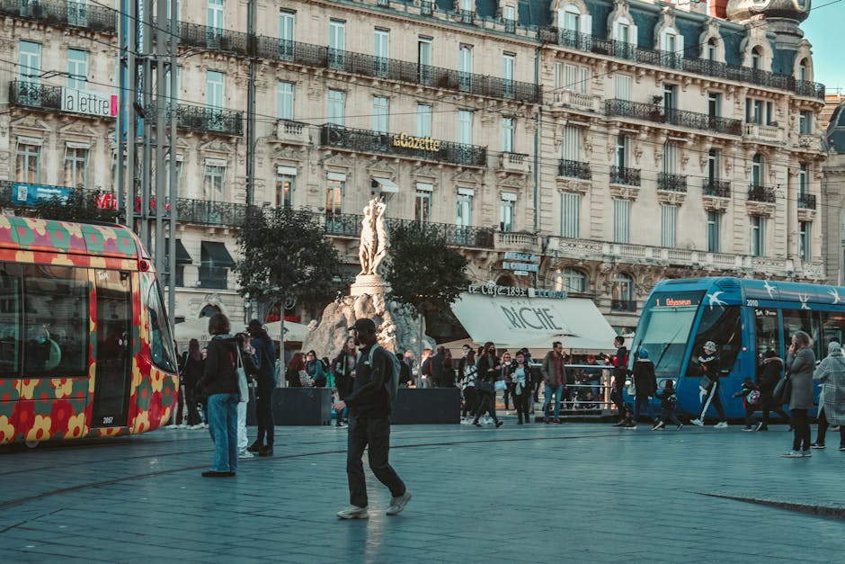 Place Castellane with trams and cafes, busy square