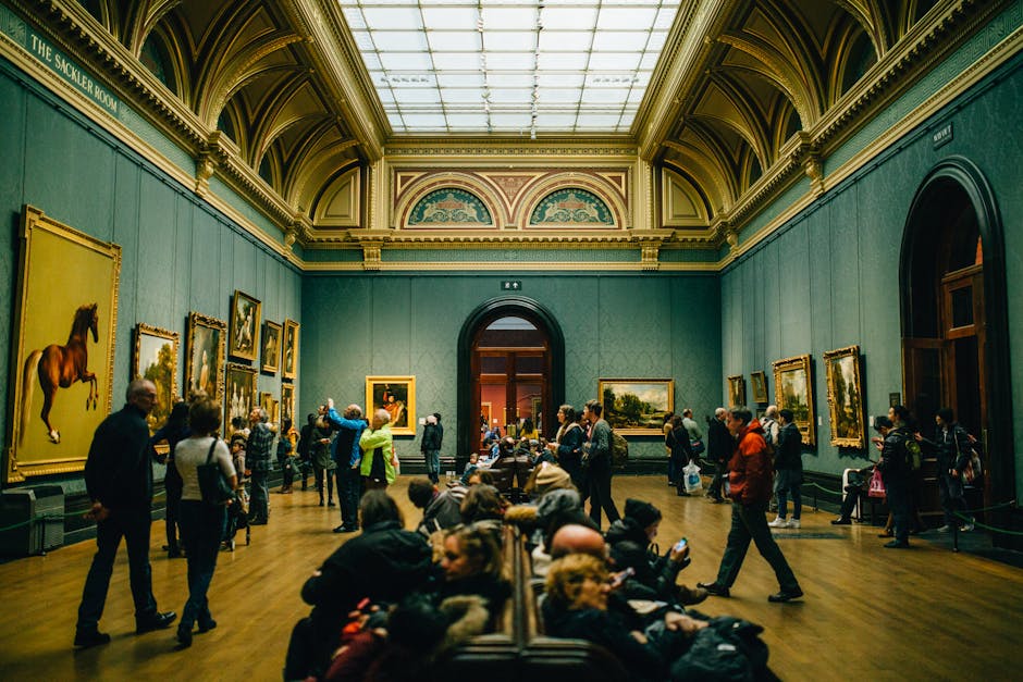 Interior of Ateneum museum with visitors admiring paintings