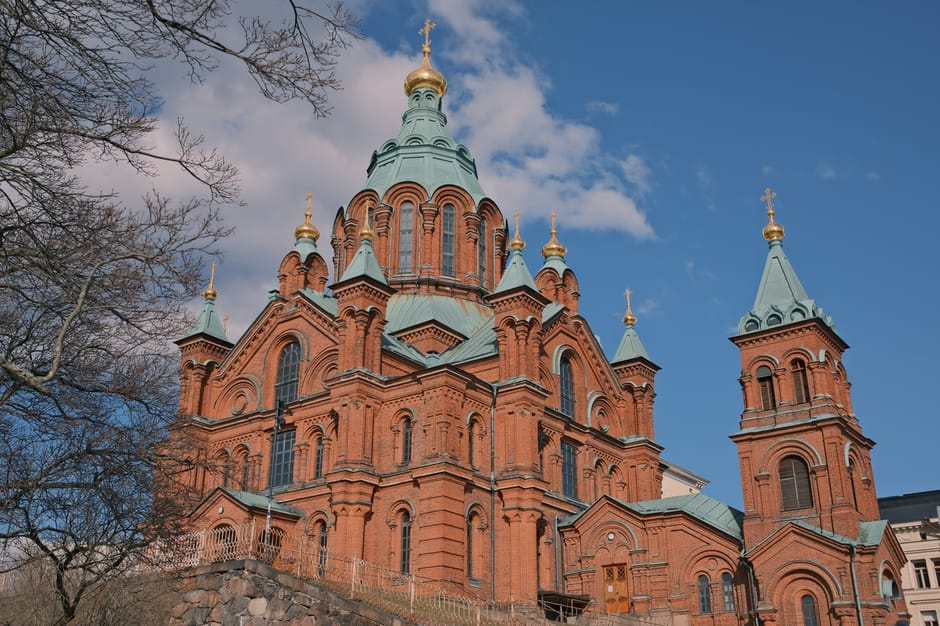 Uspenski Cathedral red brick exterior with golden domes overlooking the harbour