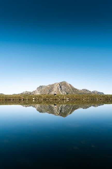 Calacuccia lake reflecting mountains