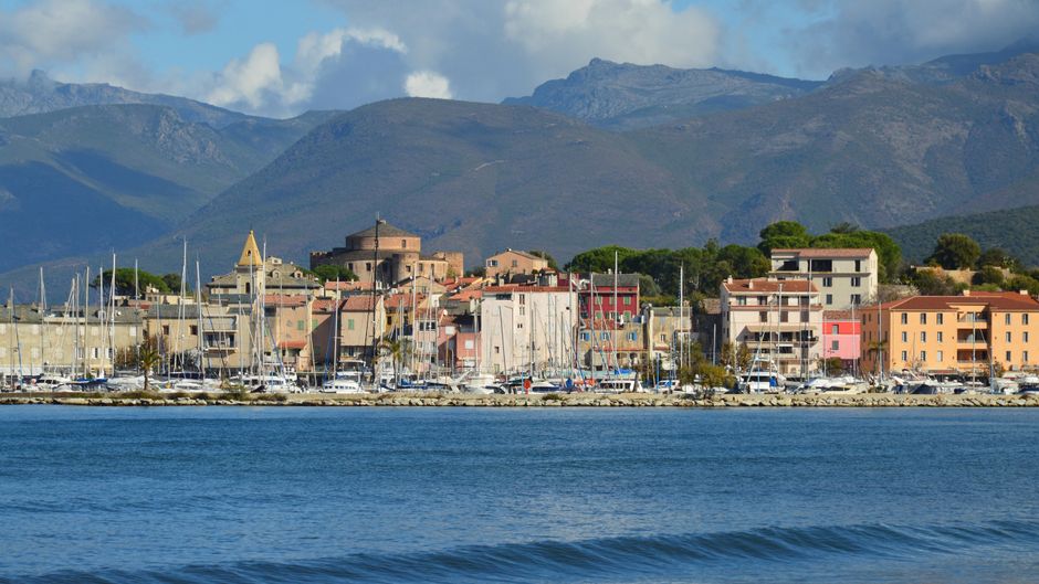 Saint-Florent port with boats and coastal village