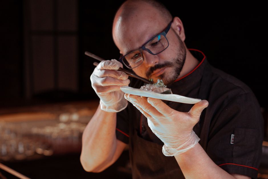 Chef plating a degustation dish in Valletta