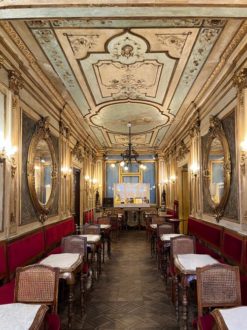 Interior of historic café with marble table at Caffè Cordina