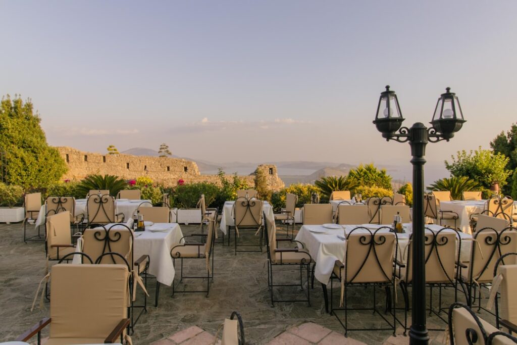 Stone vaulted restaurant terrace at sunset at Rampila in Upper Barrakka Gardens
