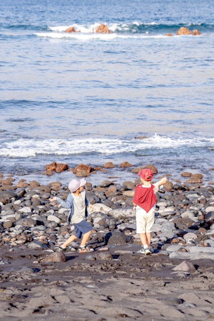 Family playing on Playa de las Vistas sandy beach