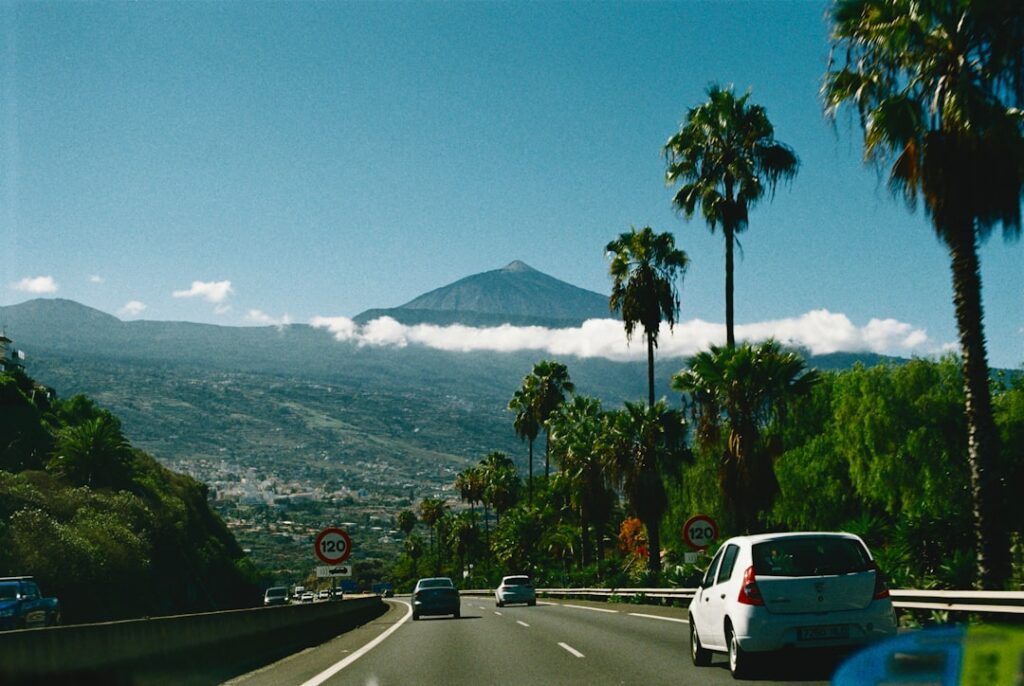 Winding mountain road in Tenerife with a rental car