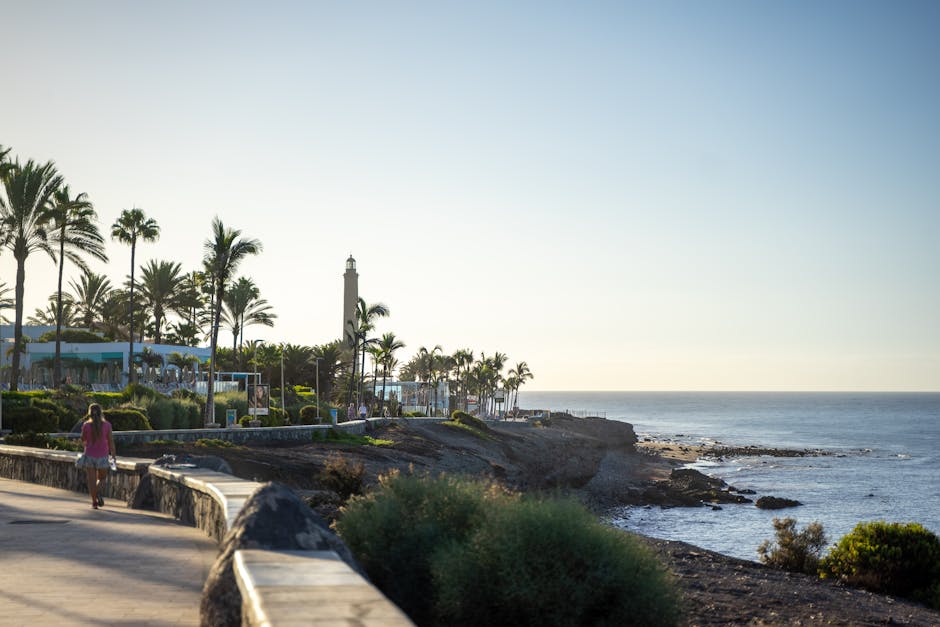 Couple walking along the Costa Adeje promenade at sunset