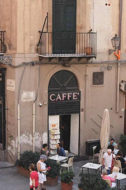 Outdoor cafe terrace on a historic narrow street in Naples