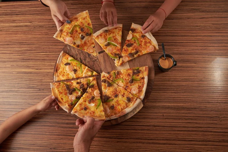 Friends sharing a pizza slice