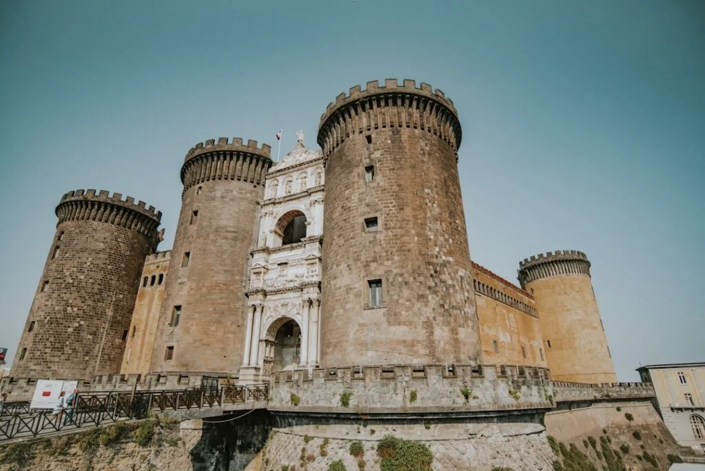 Maschio Angioino castle façade with round towers and triumphal arch, Naples.