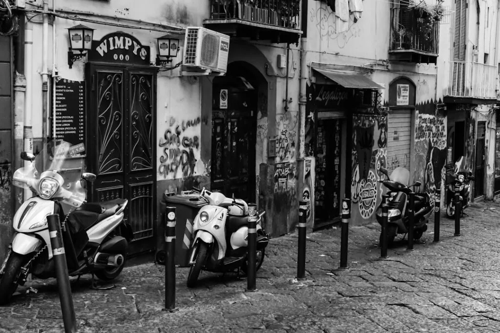 Busy Naples street with scooters in the evening