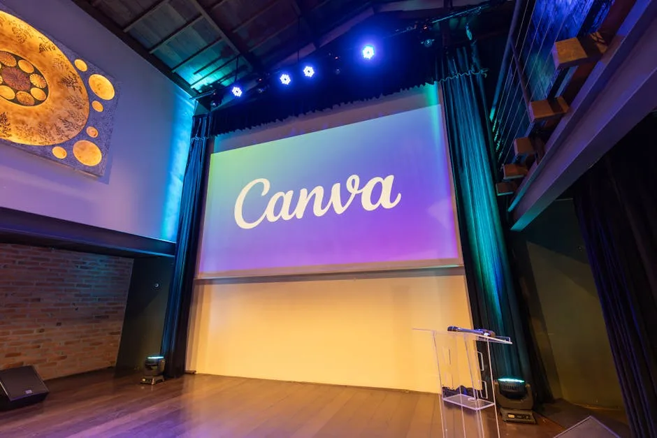 Small modern stage with 'Canva' projection and clear acrylic podium
