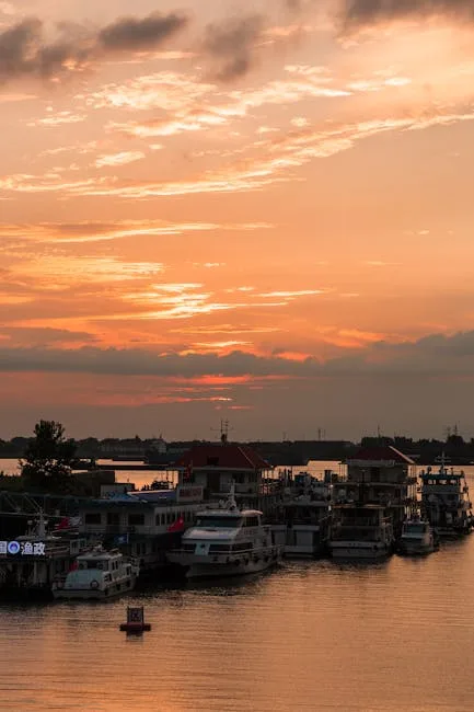 Sunset sky over moored boats along Naples harbor and pier