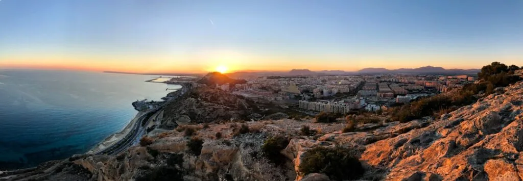 Panoramic view of Naples coastline and city at sunset from cliffs