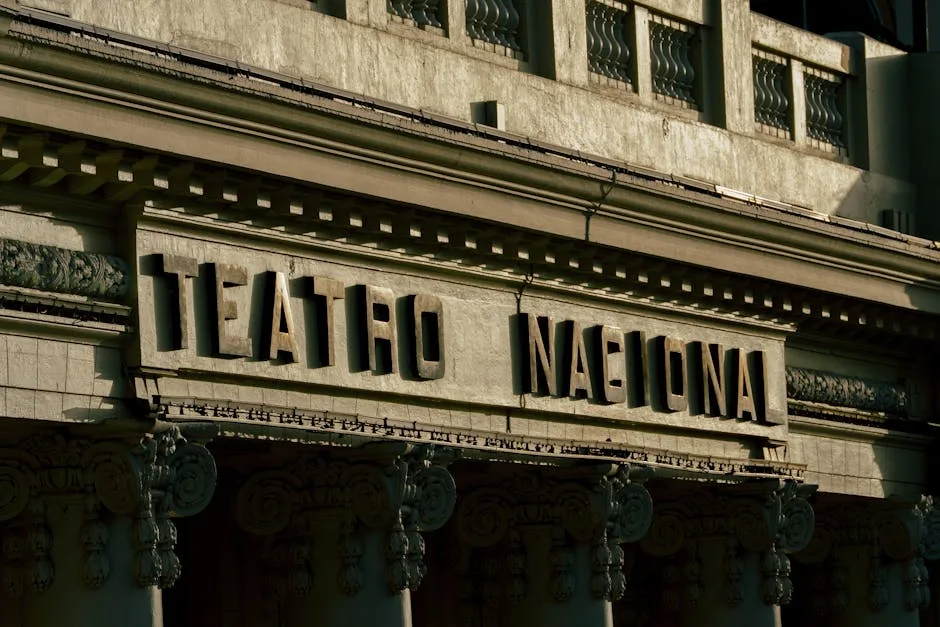 Stone facade with 'Teatro Nacional' sign on a Naples theatre