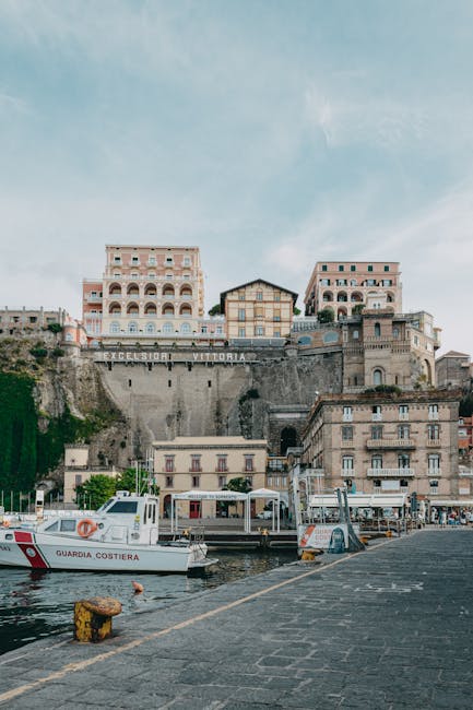 Sorrento harbor with coast guard boats beneath Excelsior Vittoria hotel near Naples