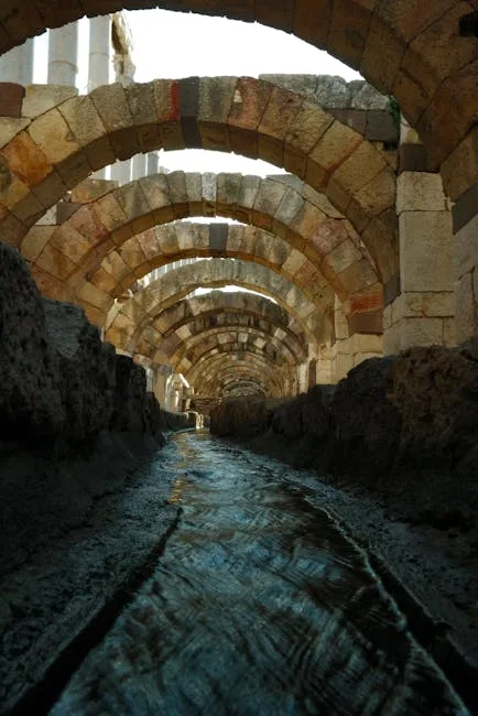Ancient arched tunnel with trickling water beneath Naples archaeological ruins