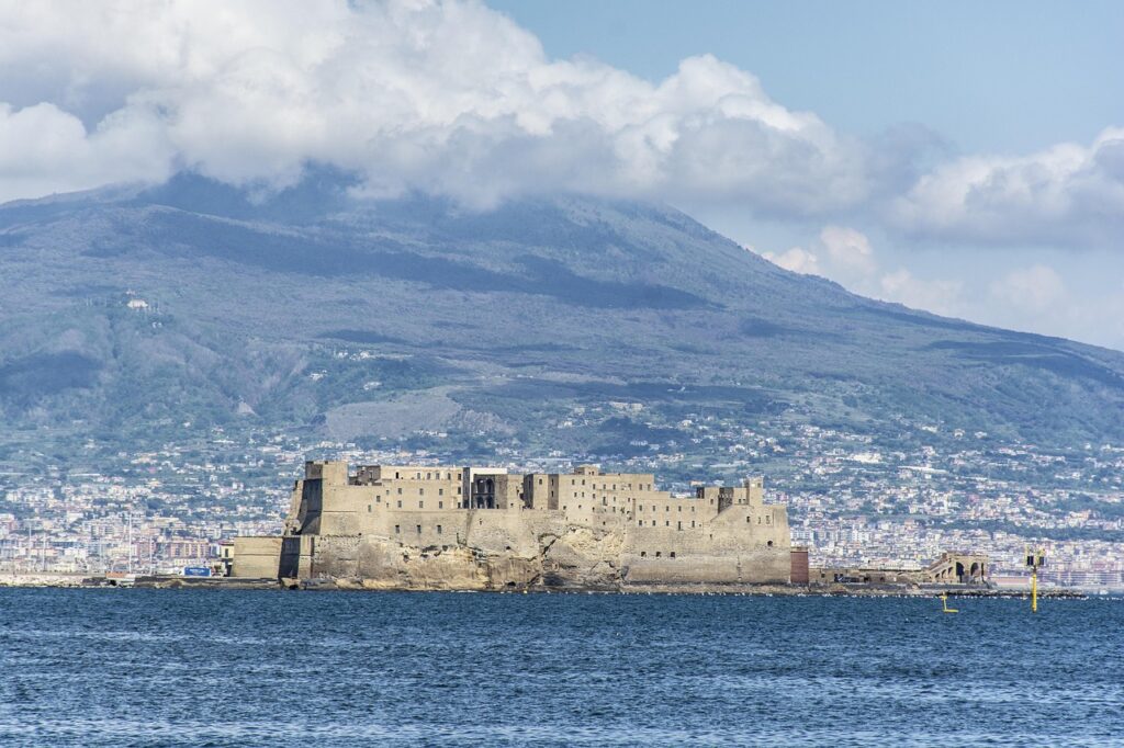 Castel dell'Ovo on its islet with waterfront view at sunset