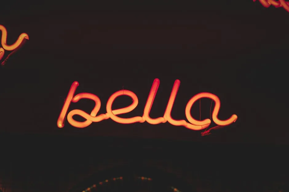 Néon rouge formant le mot « bella » sur fond sombre