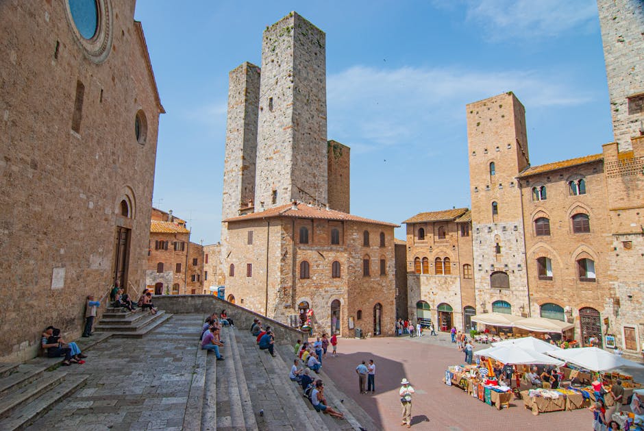 Local food market stalls in San Gimignano’s medieval piazza