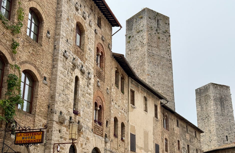 UNESCO signage in the town center with medieval towers