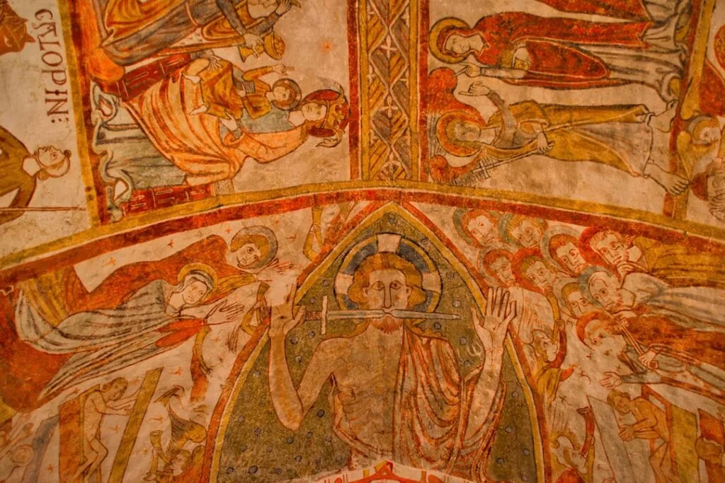 Painted medieval frescoes on a church ceiling in San Gimignano