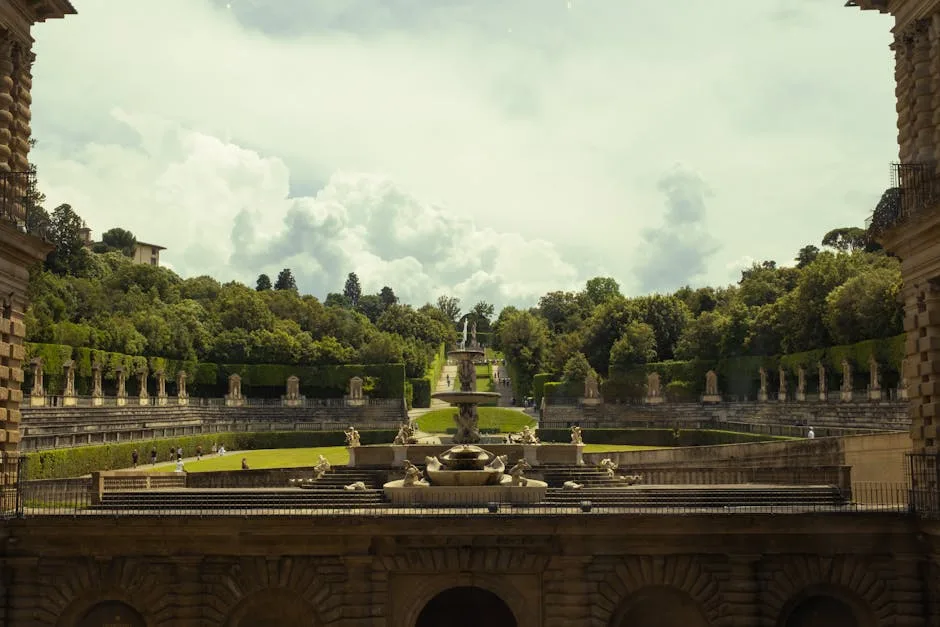View from palace overlooking Boboli Gardens terraces and distant fountains.