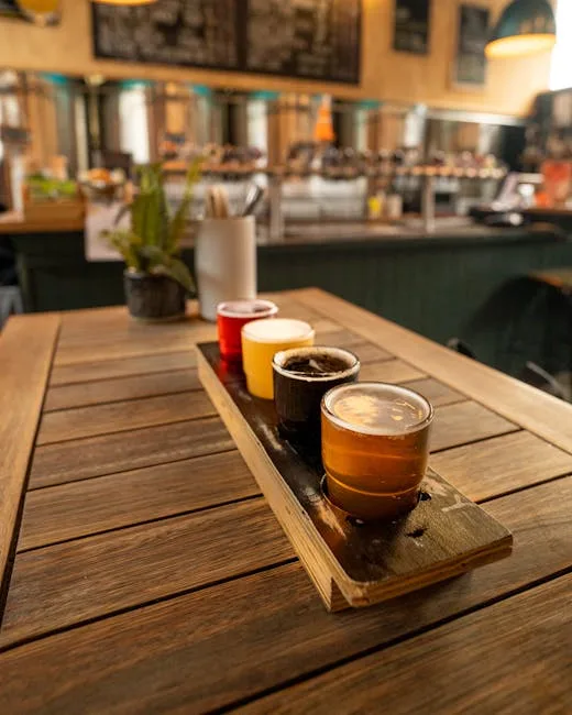 Coffee tasting flight on wooden paddle inside a Lucca café