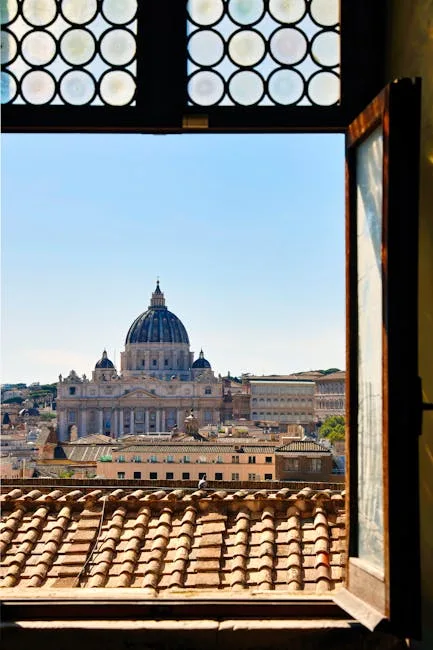 View through open window framing St. Peter's Basilica dome in Rome