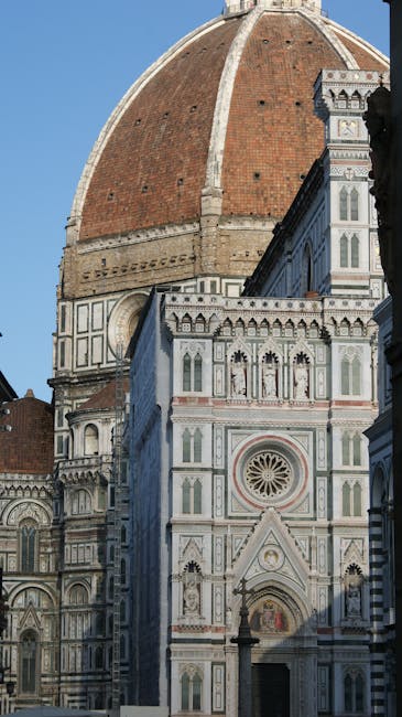 Close-up of Florence Cathedral dome and ornate marble facade in Tuscany.