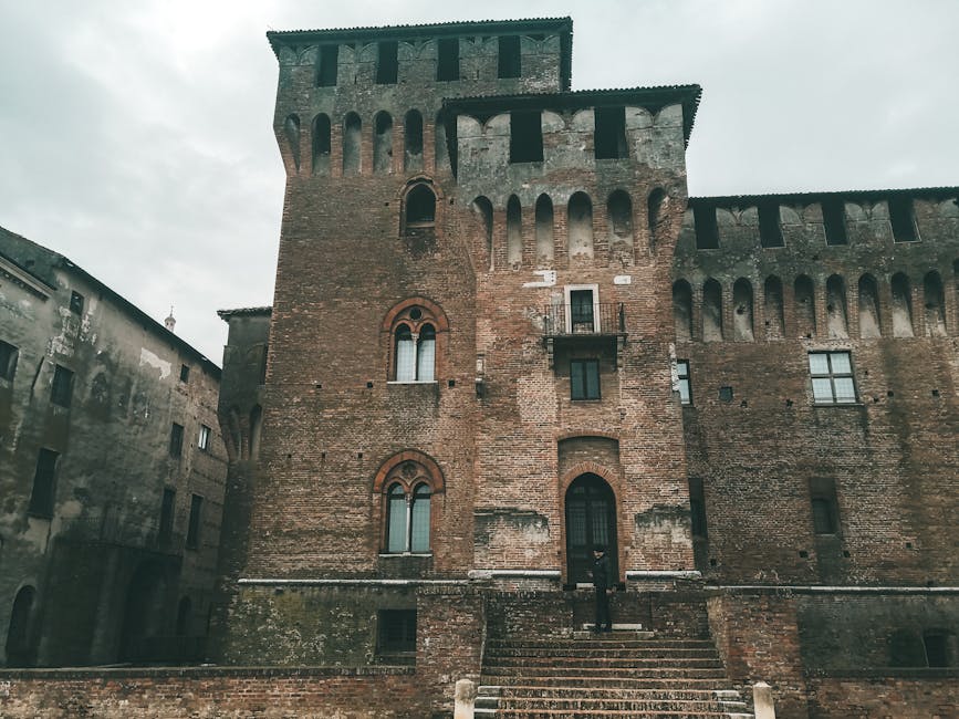 Historic brick castle facade and entrance in a Tuscan village