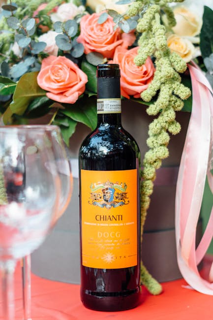 Bottle of Chianti DOCG displayed with floral arrangement, suggesting Tuscany