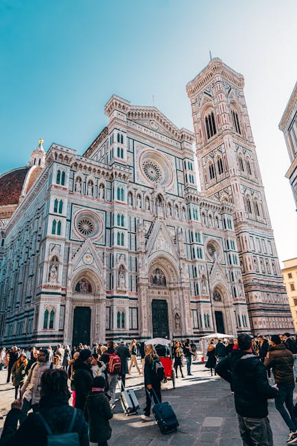 Florence Cathedral and Giotto's Campanile towering over Tuscany piazza