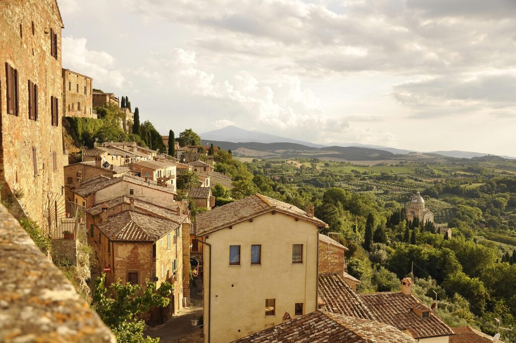 Montepulciano Piazza Grande with vineyard view through arches