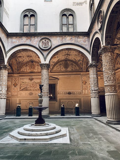 Renaissance courtyard with central fountain and carved columns at a Florence palace