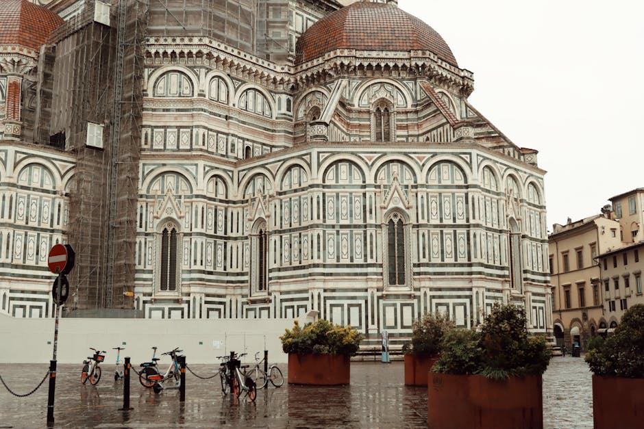 Florence's Duomo in Tuscany with bikes on rainy piazza