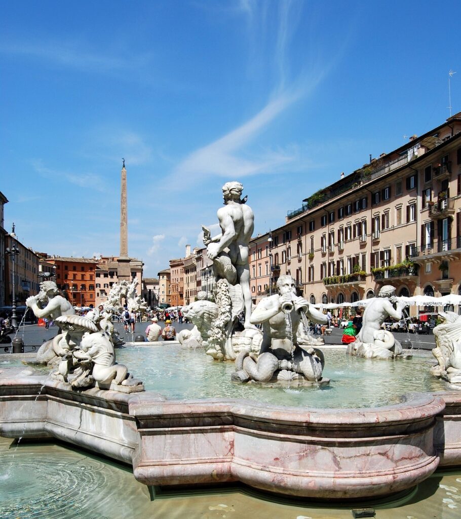piazza navona fountain with obelisk and sculptures