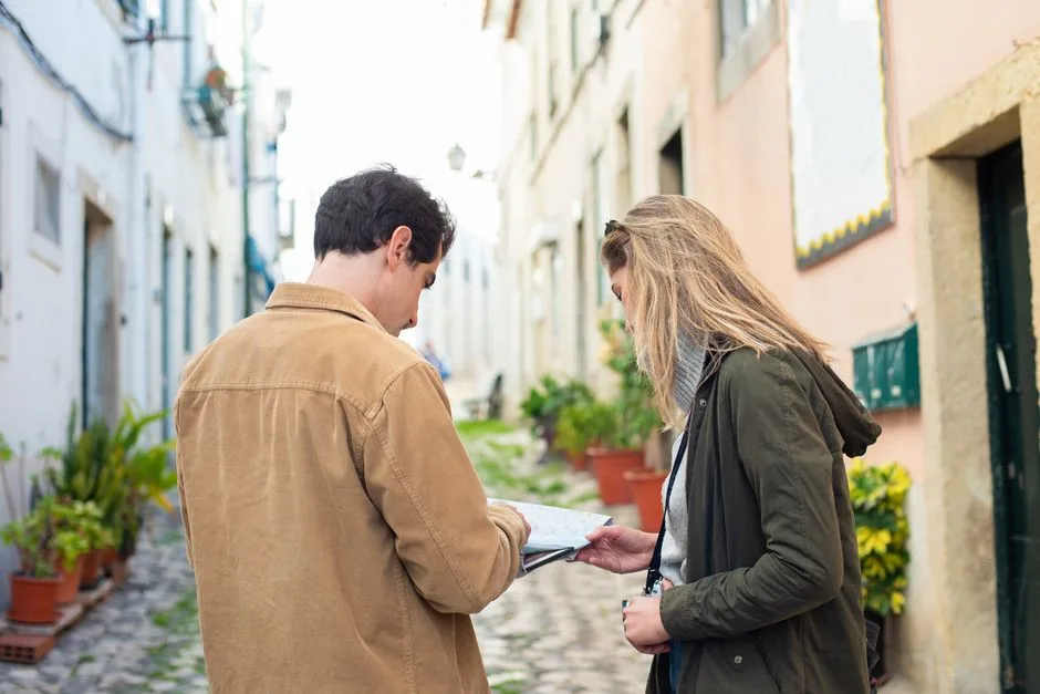 Couple walking with a map in the historic center