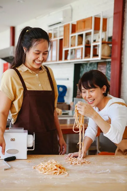 Couple making pasta in a cooking class
