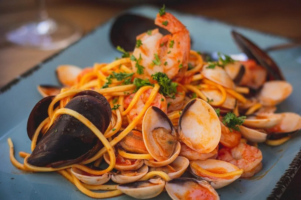 Plate of seafood pasta with mussels and shrimp, typical of Lecce