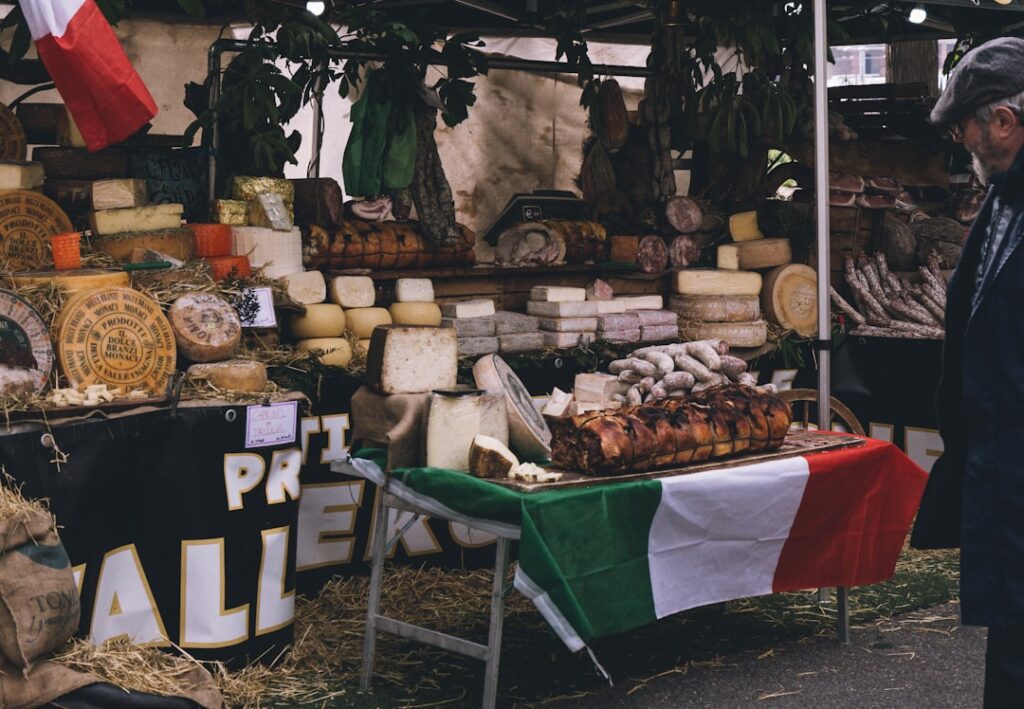 Local cheese vendor offering sample Italy