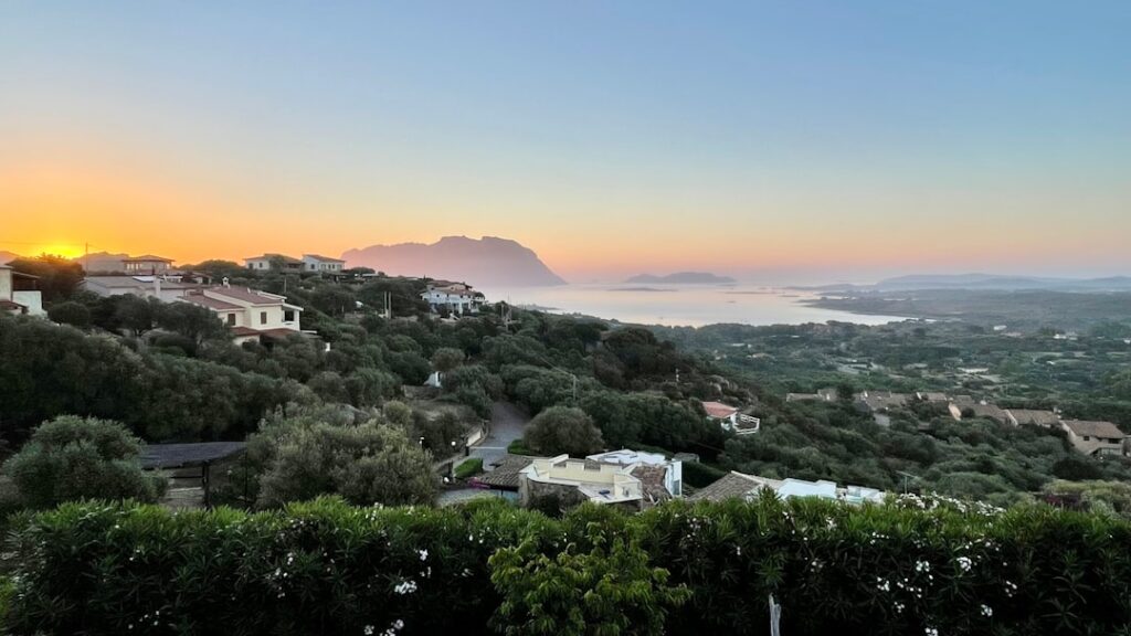 Sunrise over hillside villas and olive groves on the Amalfi Coast