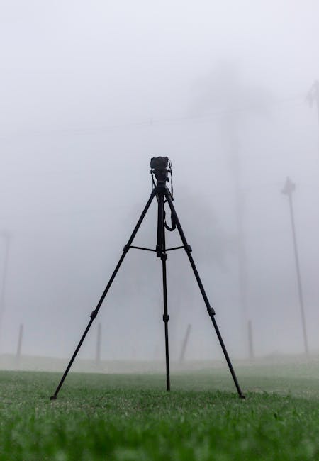 Camera on a tripod in the mist