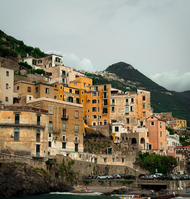 Colorful cliffside buildings stacked above the sea in Praiano, Côte amalfitaine