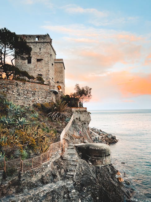Ancient coastal tower and craggy steps descending to sea on Côte amalfitaine