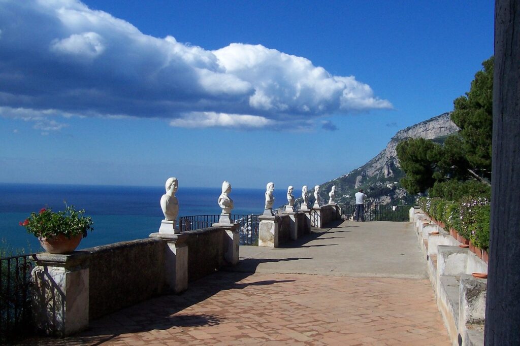 Stone balustrade and classical busts framing sea view on Amalfi Coast